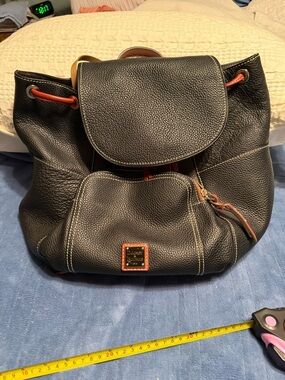 Dooney & Bourke Black Pebbled Leather Drawstring Backpack with Brown Trim